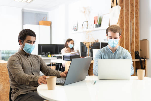 istock Working in the office during coronavirus 1299970337