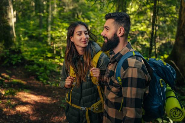 istock Hiker couple spending day in beautiful forest 1299970697