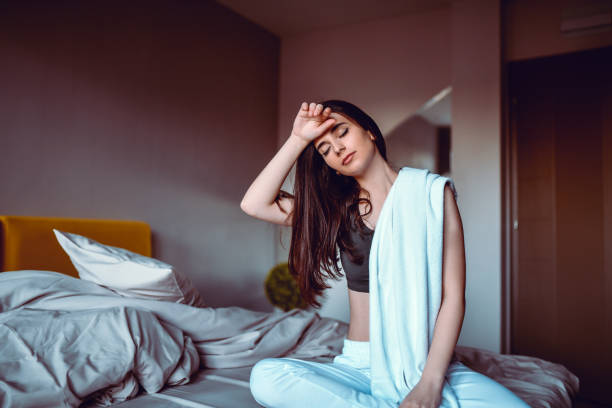 istock Cute Female Wiping Sweat After Focused Meditation 1299971022