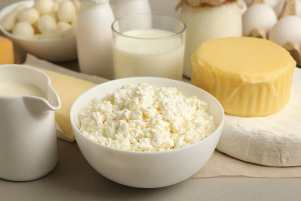 istock Different fresh dairy products on gray background, close up 1299973288