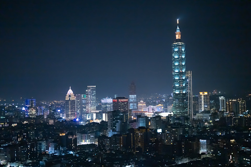 Blue hour harbour view with motion blur speedboat in Hong Kong