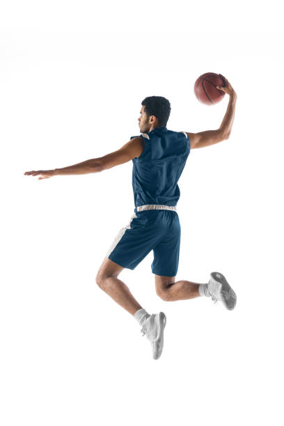 アクションでチームの若いアラビアのバスケットボール選手、白い背景に隔離された動き。スポーツ、運動、エネルギー、ダイナミックのコンセプト。 - basketball team sports healthy lifestyle isolated objects ストックフォトと画像