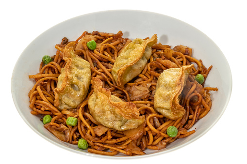 Fried vegetable gyoza dumplings with noodles - white background