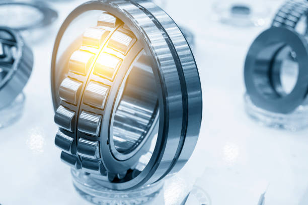 The cylindrical rolling bearing part with lighting effect. The cylindrical rolling bearing part with lighting effect. The mechanical part manufacturing concept . ball bearing photos stock pictures, royalty-free photos & images