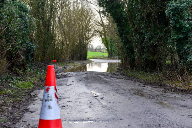 istock Country road with flood water 1299976997