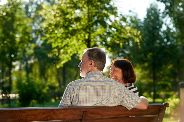 istock Senior couple on the bench back view. 1299977047