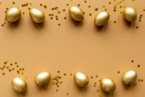 istock Golden Easter eggs with decoration. Top view 1299978480