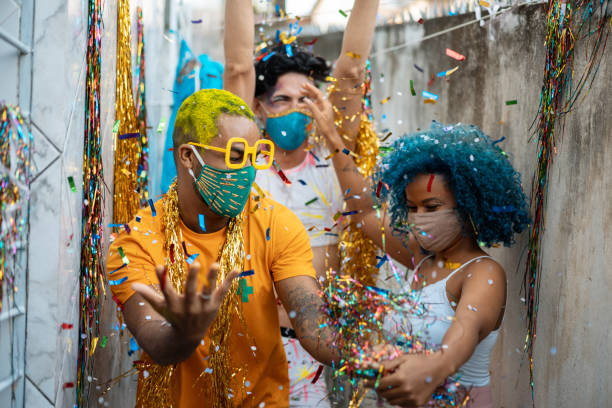 istock People dancing Carnival with protective mask 1299978807