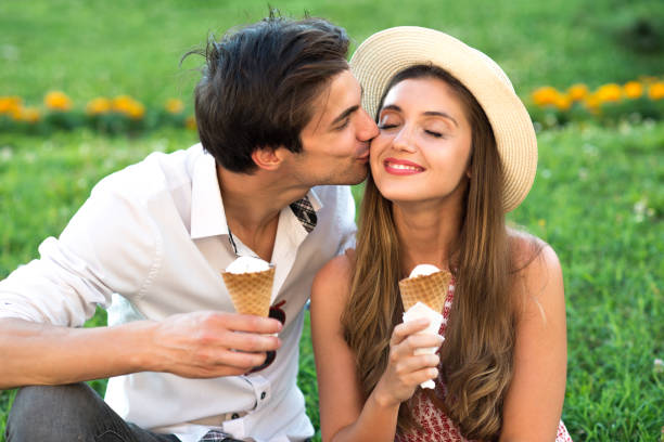 istock Young couple eating ice cream in summer 1299980019