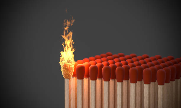 istock lit match in a group of matches. 1299980694