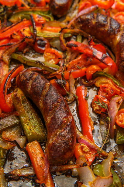 istock Sausage Peppers Onions Pan 1299980759