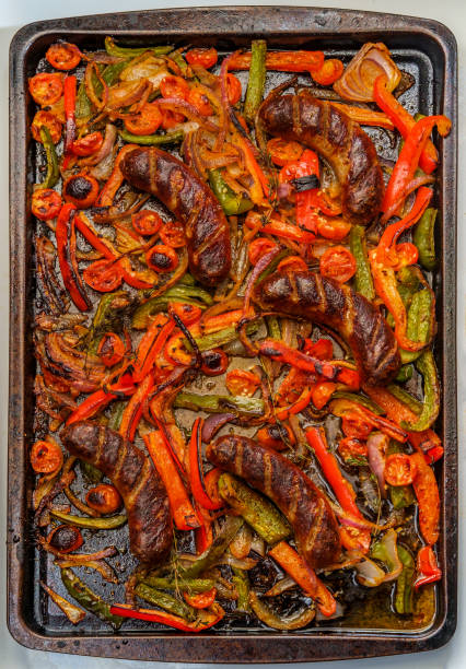 istock Sausage Peppers Onions Pan 1299980762