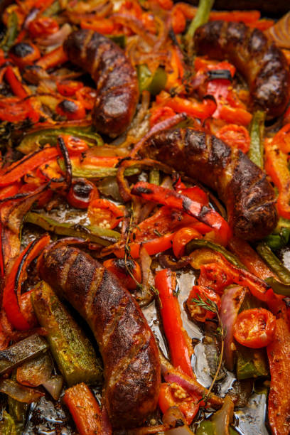 istock Sausage Peppers Onions Pan 1299980765