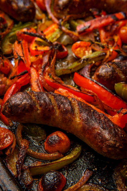 istock Sausage Peppers Onions Pan 1299980768