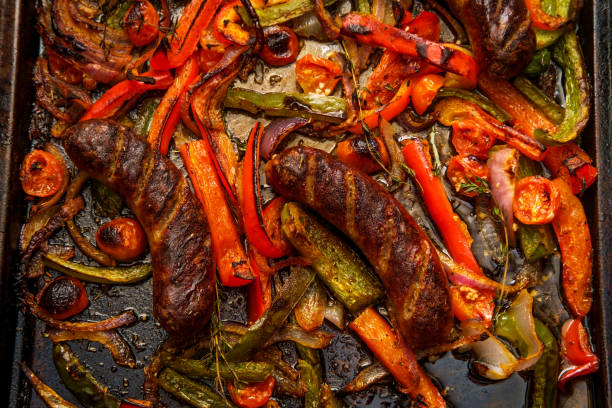 istock Sausage Peppers Onions Pan 1299980769