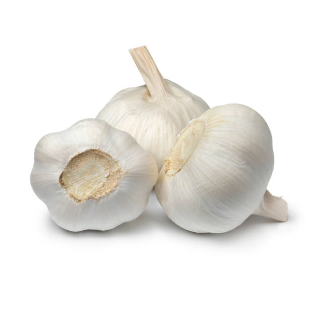 Heap of white garlic bulbs isolated on white background Heap of white whole garlic bulbs isolated on white background garlic bulb stock pictures, royalty-free photos & images