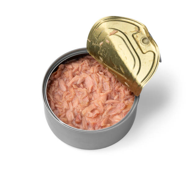 istock Open tin with tuna meat isolated on white background 1299982464