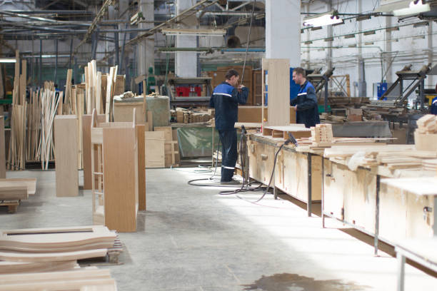 istock Furniture factory. Workers make furniture. 1299982534