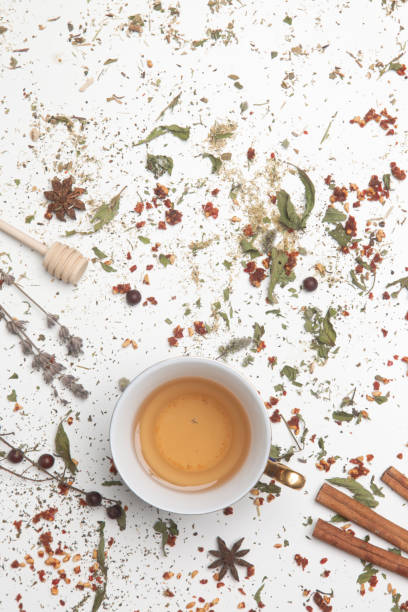 istock Herbal tea, top view. Dry herbs and tea cup on white. Herbs in bulk, zero waste and eco-friendly lifestyle, herbal medicine concept. 1299983454