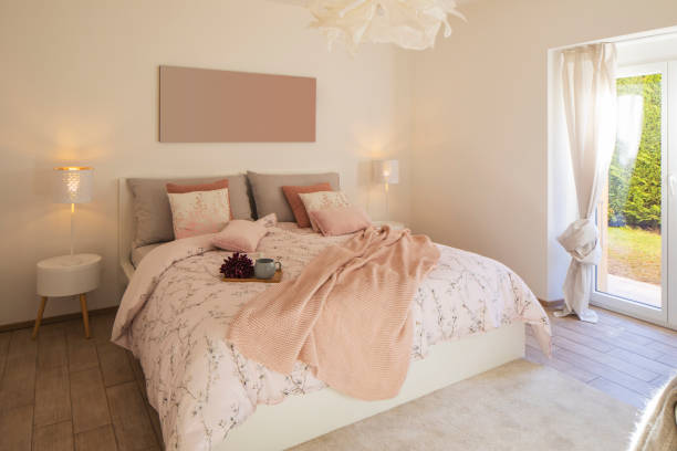 istock Modern, bright and luxury bedroom in design apartament. Fresh bed sheets and pillows above 1299983511