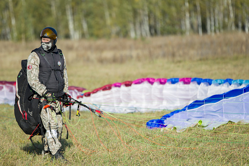 Belarus city Gomel October 7, 2018. Performances on paragliding.Paraglider paratrooper prepare to fly