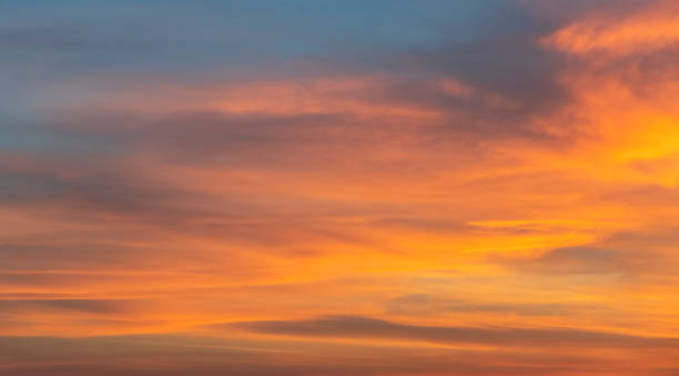 istock Beautiful colorful bright sunset sky with orange clouds. Nature sky background. Dramatic sunset. 1299984146