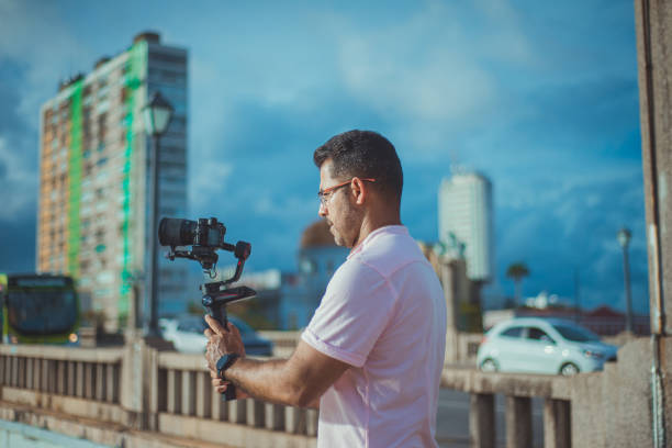 istock Close-up image of urban male photographer using camera 1299985251
