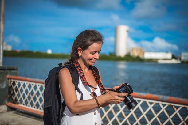 istock Close-up image of urban female photographer using camera 1299985254