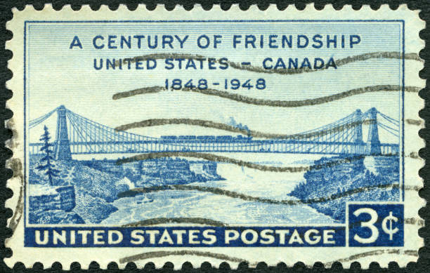 istock Postage stamp printed in USA shows Niagara Railway Suspension Bridge, 1948 1299986115