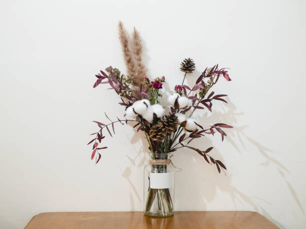 istock A vase of blooming flowers sits on a table in the interior 1299986176