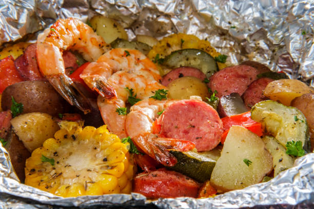 surf and turf foil packet - main course imagens e fotografias de stock