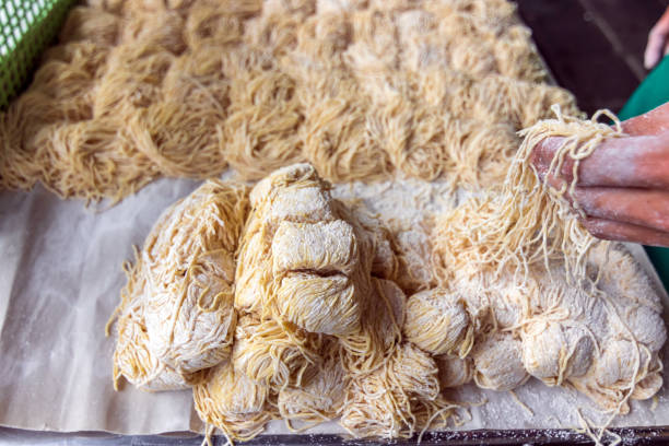 istock Uncooked egg noodles ready for simply and delicious menu. 1299986393
