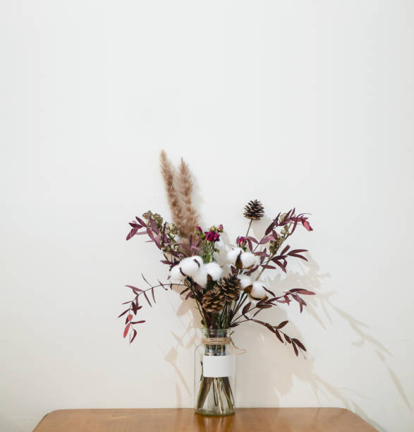 istock A vase of blooming flowers sits on a table in the interior 1299986441