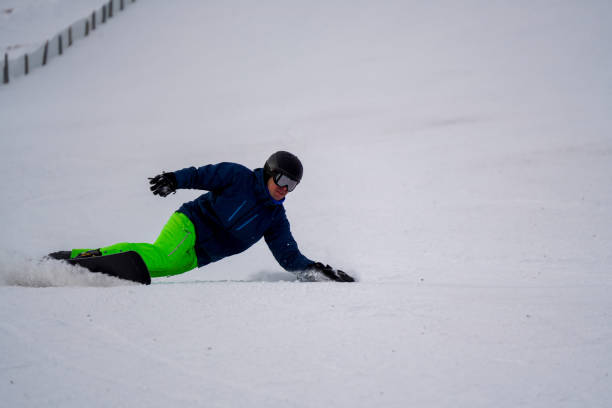 istock Snowboarder descends snow slope in the morning 1299989115