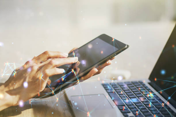 istock Creative abstract wireless technology hologram and finger presses on a digital tablet on background, artificial intelligence and machine learning concept. Multi exposure 1299992405