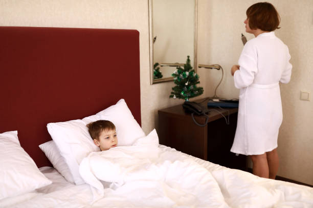 istock Mother with son in hotel room 1299992432