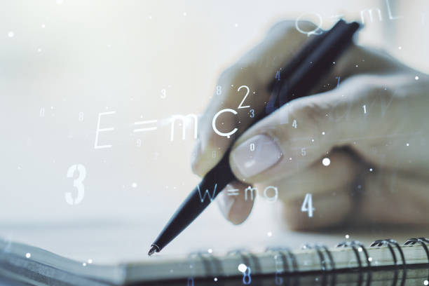 istock Creative scientific formula hologram with woman hand writing in notepad on background, research concept. Multiexposure 1299992521