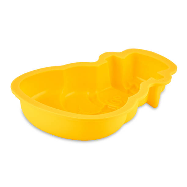 istock Yellow silicone muffin form isolated on white background. Cake cup, silicone mold, bakeware. 1299993818