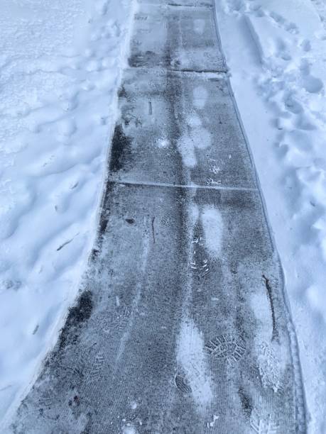 istock Snowy Winter Sidewalk after Snowblower 1299994771