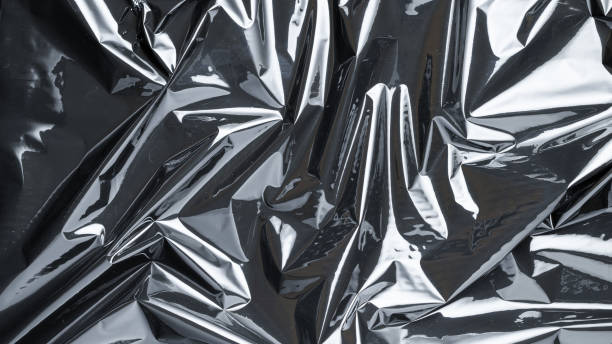 istock Plastic bag. Wrap transparent dark cellophane texture. Black shiny film pattern. Creative crumpled background. 1299996227