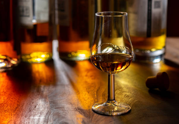 istock Dram of single malt scotch whisky and bottles on background 1299997073