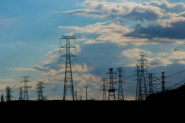 istock power towers on blue sky 1299997910