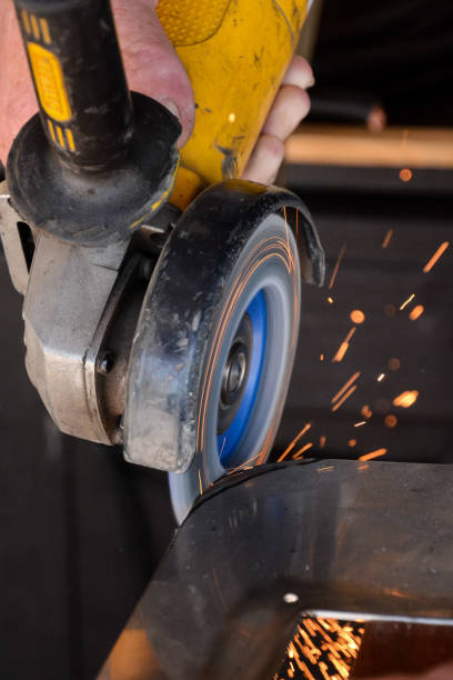 istock Cutting steel with angle grinder at car service 1300000308