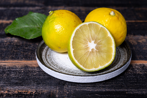 Fresh ripe bergamot orange fruits, fragrant citrus used in earl grey tea, medicine and spa treatments, close up