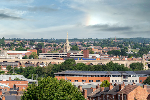 Taken from a high point in Mansfield, Nottinghamshire showing the old town from a panoramic view as a train travelling over the viaducts heads towards the station