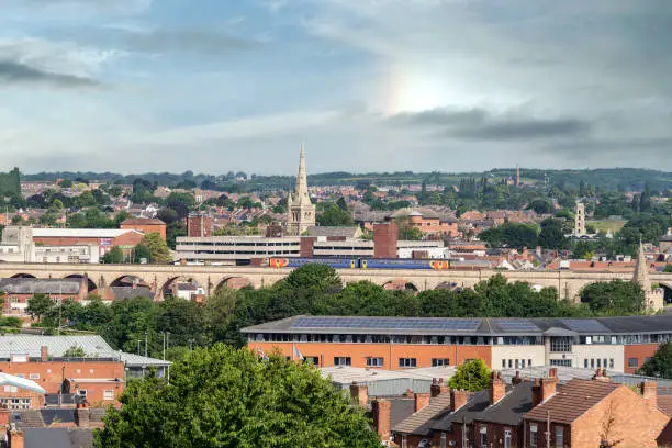 Taken from a high point in Mansfield, Nottinghamshire showing the old town from a panoramic view as a train travelling over the viaducts heads towards the station