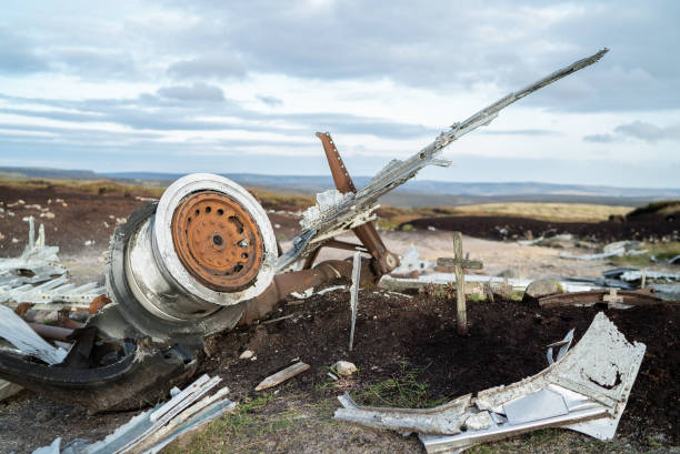 Abandoned B29 WW2 American AS Airforce Bomber Overexposed crash site on Bleaklow Moor with rusty aircraft engine parts and aeroplane landing gear wheels wreckage strewn across Peak District landscape