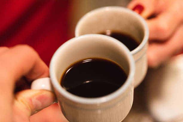 istock Hands holding some cups of coffee 1300004390