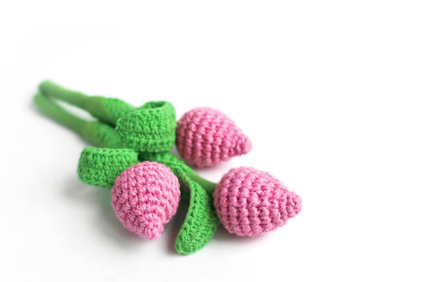 istock Handmade knitted pink tulips 1300004802
