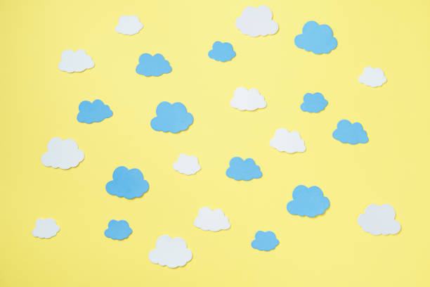 istock Creative composition of orange background surrounded by clouds mockup, copy space 1300005003